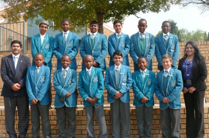 The boy prefects have been chosen for 2014 at Mulbarton Primary School are keen to get on with their jobs. Left, Mr L Kistadoo (principal) and right, Mrs S Singh (deputy principal). 