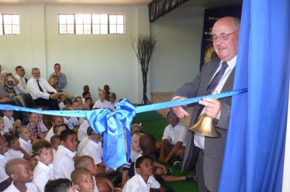Principal, Mr Looyen, cuts the ribbon to mark the opening of St Declan's.